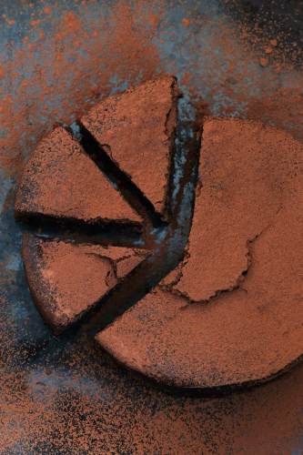 Chocolate cake with three segments cut out