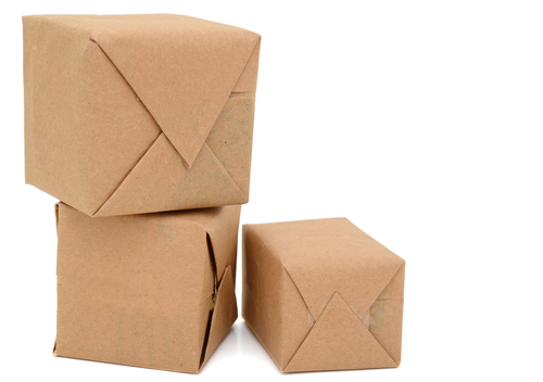 three parcels wrapped in brown paper.