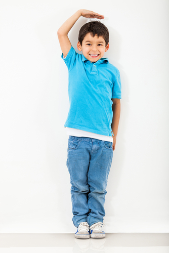 boy measuring his height