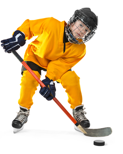 Boy playing hockey in a yellow kit