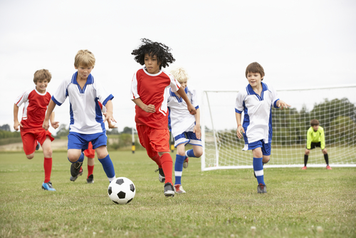 boys playing football