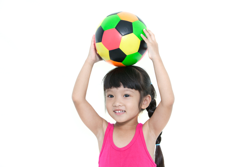 little girl with football