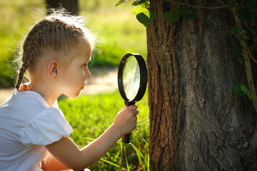 girl with magnifying glass