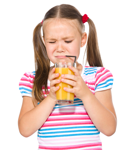 Girl drinking orange juice