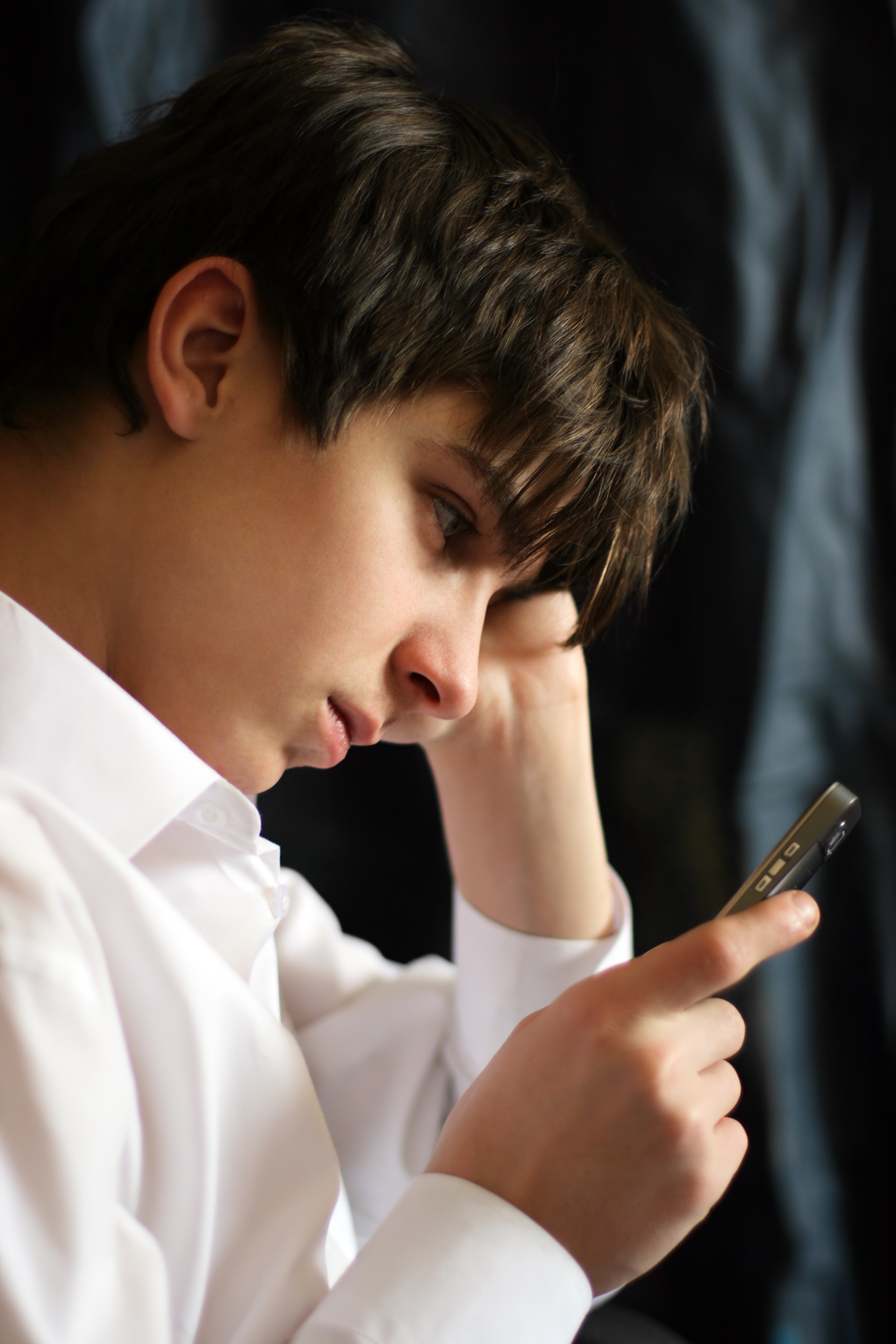 boy looking at phone