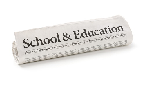 'School & Education' written on newspaper