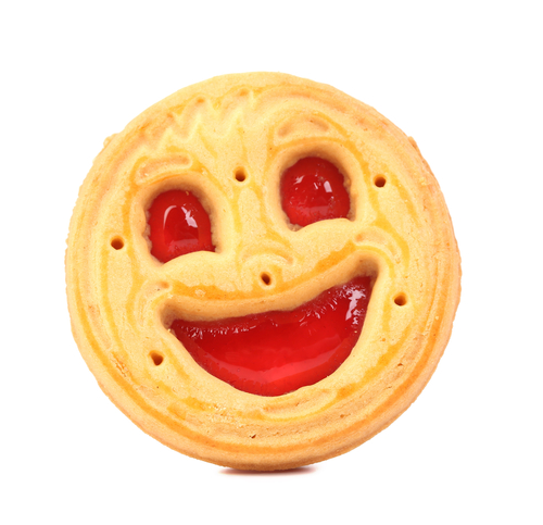 A smiling jam biscuit