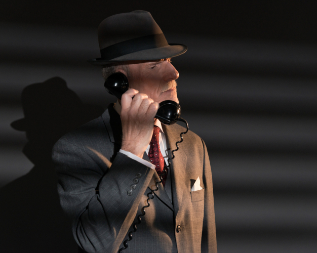 a detective on a phone