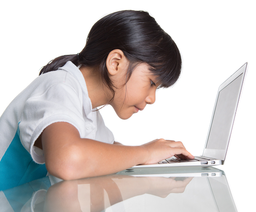 Girl typing at a computer