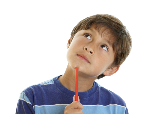 Boy with pencil looking thoughtful