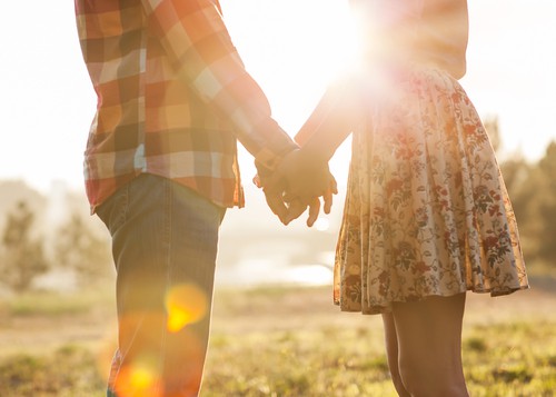 girl and boy holding hands