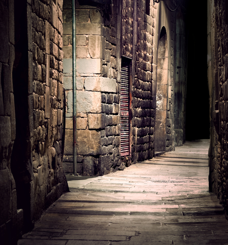 Dark alleyway with stone walls