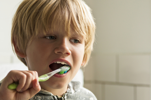 boy cleaning teeth