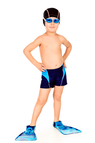 boy in flippers and swimming trunks