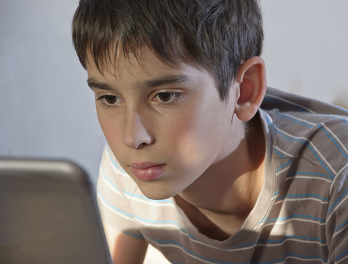 boy playing on computer