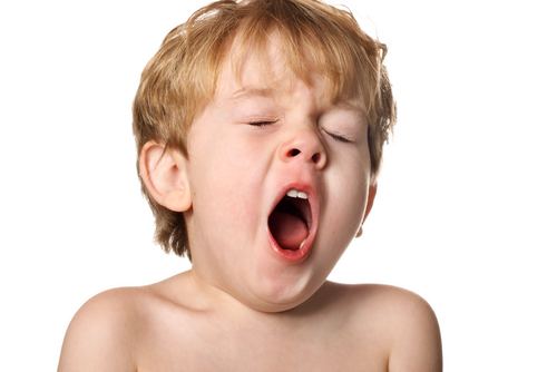 boy yawning