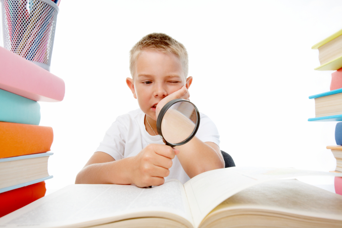 boy with magnifying glass