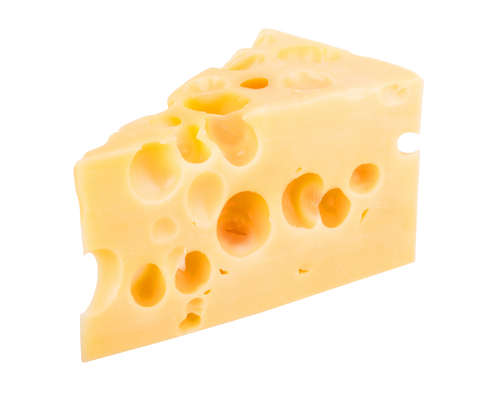 A triangle of cheese with holes