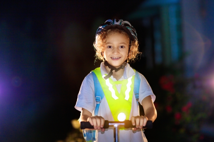child in reflective jacket