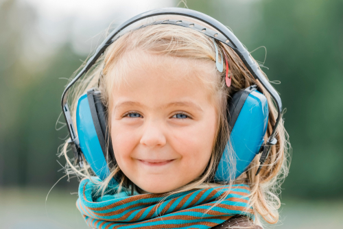 girl wearing ear defenders