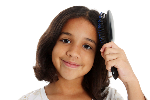 Girl brushing hair