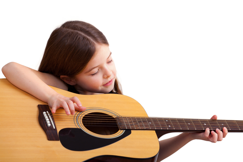girl playing a  guitar