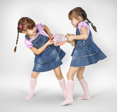 Girls fighting over a doll