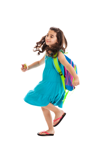 girl wearing a backpack and summer dress