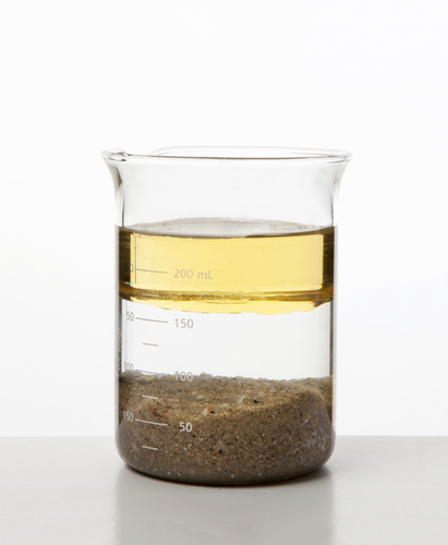 sand and oil in water