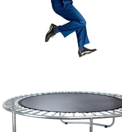 person jumping on a trampoline