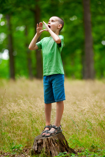 boy shouting in forest