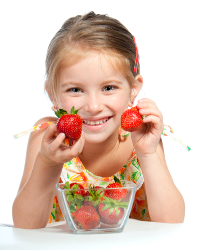 Girl holding strawberries