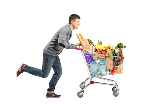 man pushing supermarket trolley