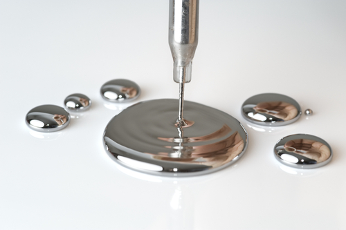 Mercury pouring from a pipette - stock photo