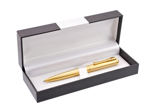 A gold ballpoint pen in a box