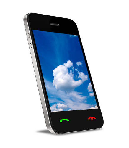 A mobile phone with blue sky and clouds on the screen.