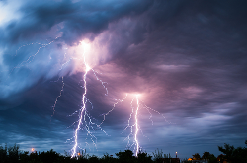 Dark cloudy sky and lightning flashes.