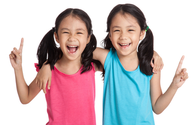 Two girls smiling.