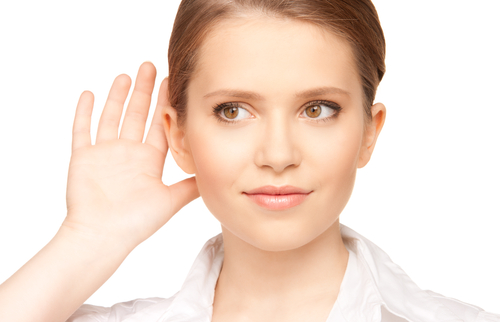 A lady cupping her ear