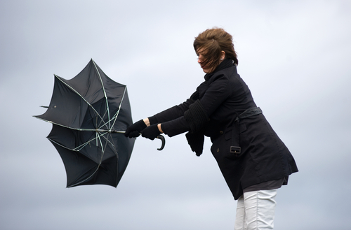 lady in wind with umbrella