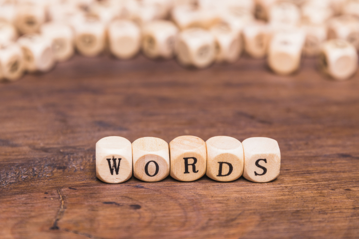 Beads with letters on put together to create the word 